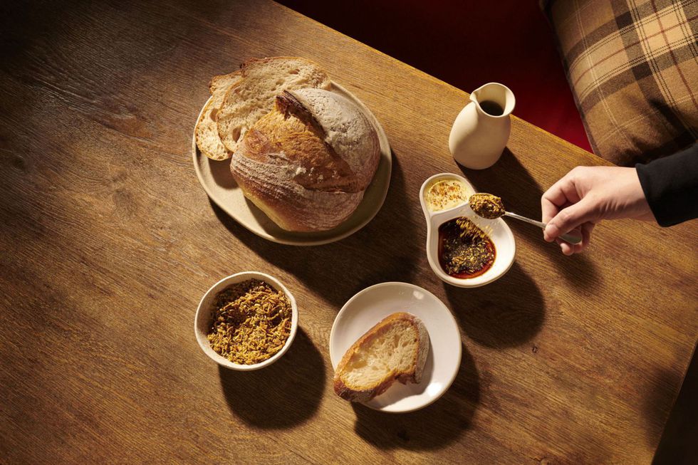 Coworth Park_The Barn_ House sourdough with cultured butter and garden herb Dukkha_Dorchester Collection.jpg